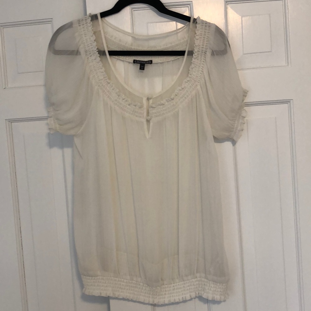 Sheer white blouse.